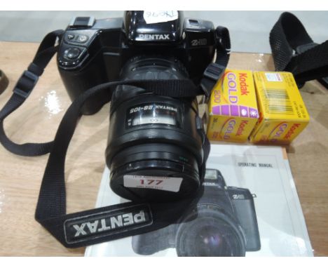 A Pentax Z-10 with Pentax 28-105 zoom lens and operating manual