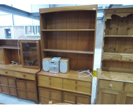 A vintage teak Nathan lounge unit having open shelf section over drawer and cupboard base