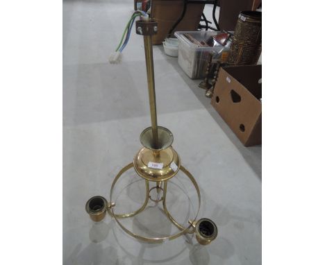 A brass ceiling light fitting