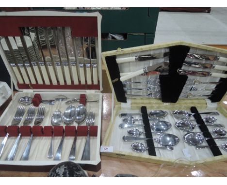Two vintage sets of cased cutlery