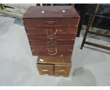 Two sets of vintage office index storage drawers