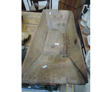 A vintage wooden trug