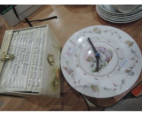 A Beatrix Potter plate clock by Royal Abert and a cased set of Tales