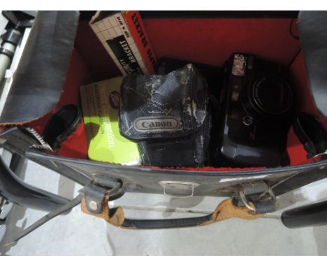 A camera bag containing Canon Sure Shot Max, a Ricoh RZ-3000, a Pacer Companion Flashgun etc