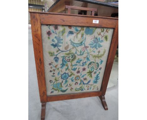 A vintage oak framed tapestry firescreen