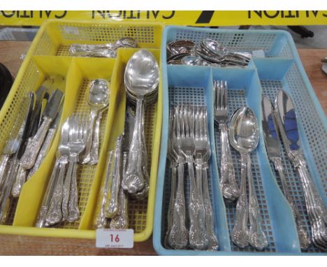 A selection of cutlery, in vintage plastic drawer trays