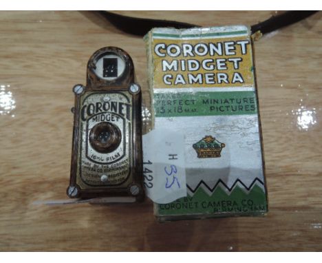A Coronet Midget 16mm Camera in original package