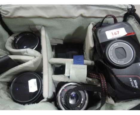A Nikon TW Zoom 35-70mm Macro Camera and a selection of lenses including a Canon EW-68B EF 35-70mm Serial no. 1278620, an RMC