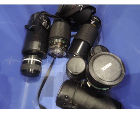 A selection of camera lenses including a Konica Hexanon AR 35mm F2.8 lens and a Tamron 200mm F/3.5 Adaptall 2, an Ozeck 2 Aut