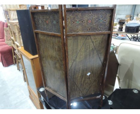 A vintage bifold firescreen
