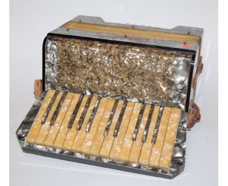 A Geraldo Italian piano accordion in fitted leather case