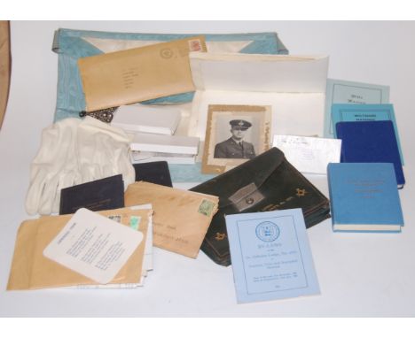 A collection of assorted Masonic regalia and effects to include sash, gloves, various boxed jewels and hand books etc