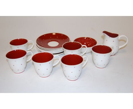 A Susie Cooper part tea service, on a white ground with red dot decoration