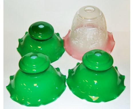 A Victorian style cranberry tinted glass ceiling light fitting, together with a set of three green glass light fittings (4)
