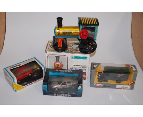 A boxed clockwork road-roller; together with a boxed Corgi Classics 1929 Thorneycroft van, and a Corgi MG Maestro etc 