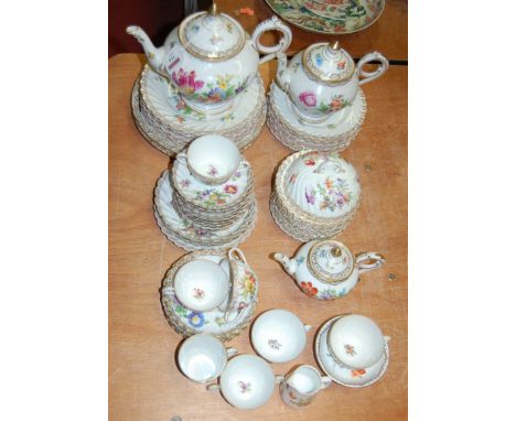 An early 20th century Dresden porcelain part tea service, each decorated with floral sprays within gilt borders    Condition 