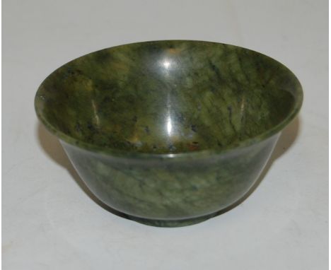 A small nephrite jade shallow bowl, dia. 7.5cm