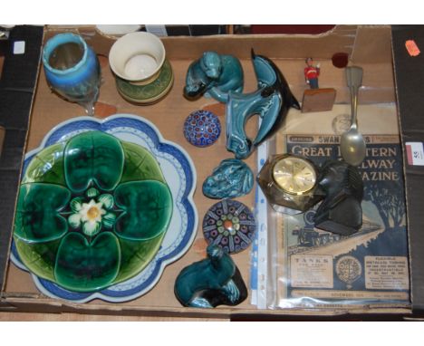 A box of miscellaneous items to include Poole Pottery figure of a seal, Poole pottery of a leaping dolphin, uranium glass vas