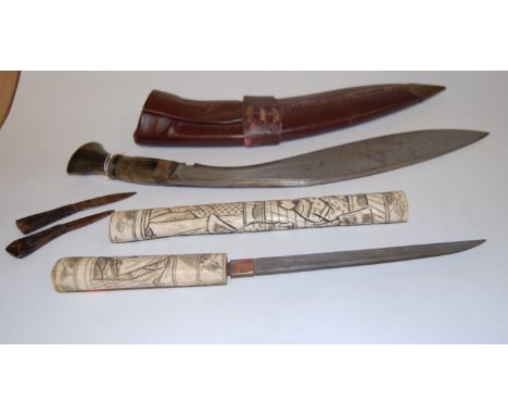 A Japanese export sectional bone Tanto style dagger together with a mid 20th century kukhri having steel blade and turned bon