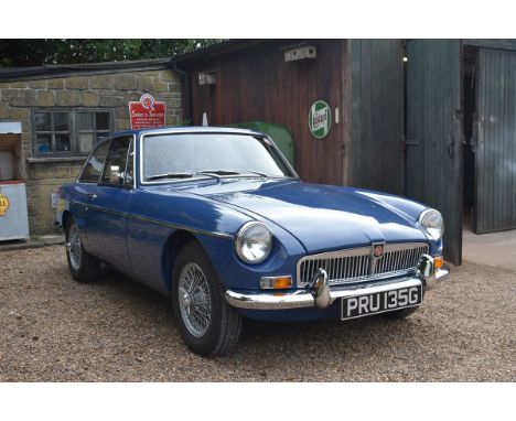 A 1969 MG B GT, registration number PRU 135G, chassis number G-HD4/176407-G, engine number 18GG-WE-H/5528, Mineral blue. PRU 