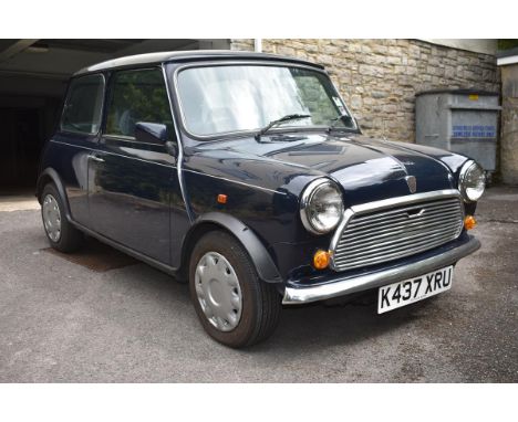 A 1993 Rover Mini Mayfair, registration number K437 XRU, blue.  This Mini Mayfair is in time warp condition having had one la