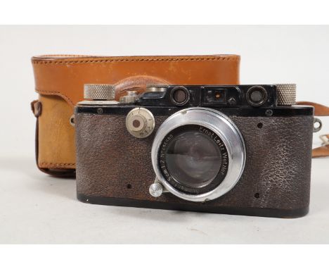 A Leitz Wetzlar Leica III Rangefinder Camera, black, serial no 48516, carrying the s/n of a 1930 Leica I, this has apparently
