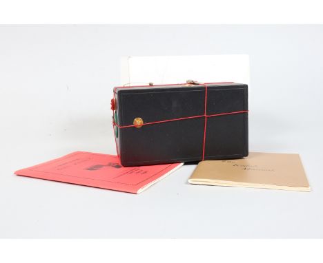 A Kodak Number 1 100th Anniversary Replica Camera produced in 1988 to mark the 100th anniversary of the first Kodak camera, b