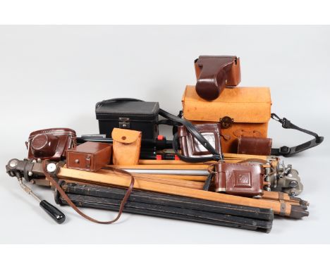 Tripods and Cases, four wooden tripods, one black, one Bell &amp; Howell  Filmo Tripod, others unmarked, ECR camera cases, le