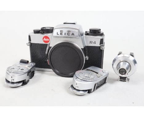 A Leica R4 SLR Body, made by Leitz Portugal serial no 1574692, 1982, chrome body F-G, some corrosion bubbling above lens moun