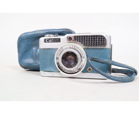 A Blue Canon Demi Half Frame Camera, serial no 406773, body P-F, storage deterioration, leatherette lifting, shutter fires, m