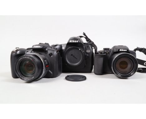 Three Digital Cameras, a Nikon D70 camera body, powers up, shutter working, flash working, other wise untested, body G, some 