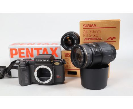 A Pentax SFXn Camera, powers p, shutter working, otherwise untested, body G, in maker's box, with a Sigma 24-70mm f/3.5-5.6 z