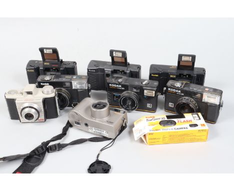 A Tray of Kodak Compact Cameras, a K10, K12, K14, the K14 original battery still has some charge, others untested, a Signet F
