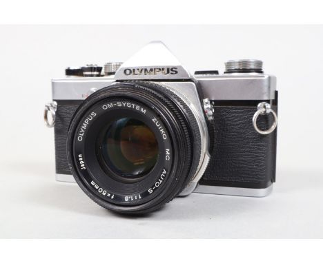 An Olympus OM1 SLR Camera, shutter sluggish on slow speeds, meter responsive, self timer working, body G, with Zuiko 50mm f/1