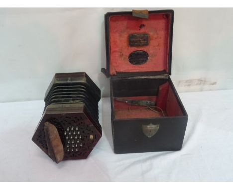 A 19th century 47-button concertina in a rosewood case, bearing labels for G Wheatstone & Co and J J Vickers