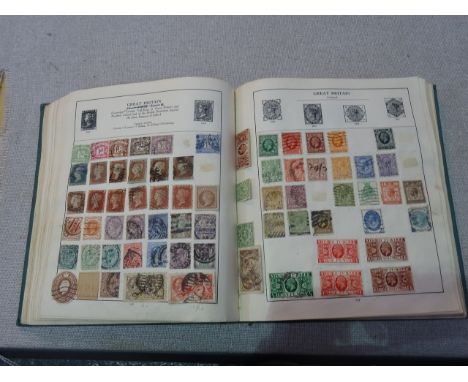 A vintage stamp album of World & GB to include Twopenny Blue, Penny Reds & 1937 Coronation sets mounted mint to Colonies & Co