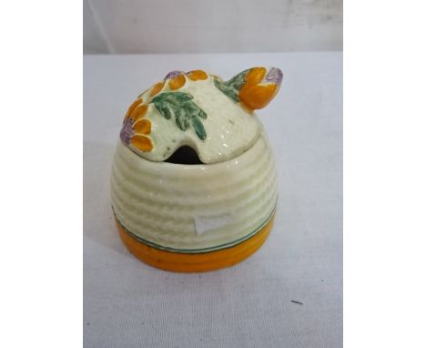 A Clarice Cliff honey pot and Carltonware leaf dishes