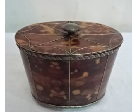 A pewter faux tortoiseshell tea caddy