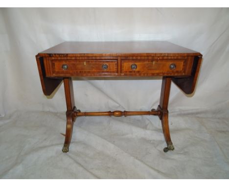 An Edwardian style mahogany and cross-banded sofa table
