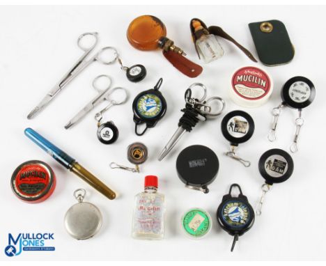 A collection of fly vest tools and treatments, as follows: Pocket watch style push button opening with dryer, oiler. Valve sp