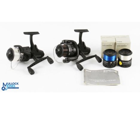 A pair of Fox Stratos FS 7000E fixed spool reels, both with boxed spare spools, both with good bails and rear tensioners. Bot