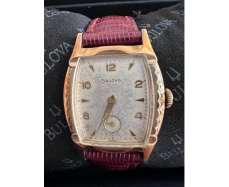 A 1955 manual 'Senator' Bulova wristwatch with subsidiary seconds dial, rectangular face and fluted bezel. In black Bulova ca