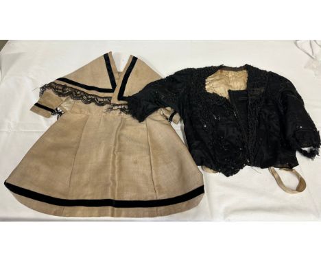 Two Victorian items of clothing to include a child’s dress in brown with black velvet trim, lace sleeves and shoulder coverin