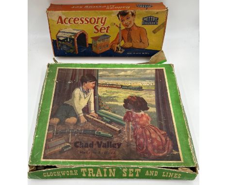 Chad Valley Clockwork Train Set and Lines together with a Mettoy Tin Plate Railway Accessory Set containing various buildings