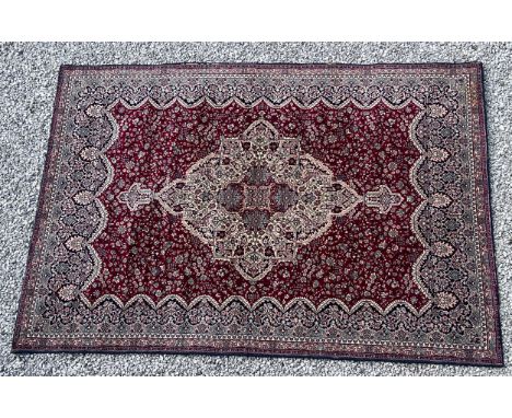 A good quality red ground wool carpet 315cm x 223cm. 
