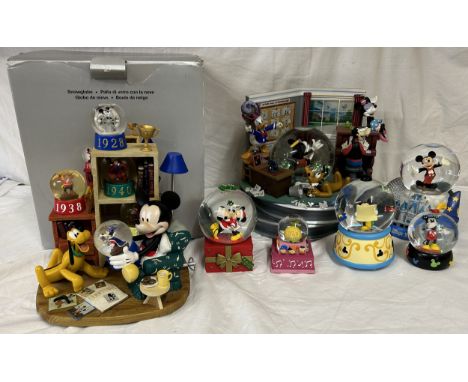 Selection of 7 Disney Snow Globes to include 5 musical globes. 1 boxed musical globe' The Sorcerers Apprentice' 24cm h. Peter