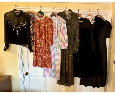 A large quantity of vintage clothing to include a 1980's black cotton Laura Ashley dress, a black velvet and chiffon button d