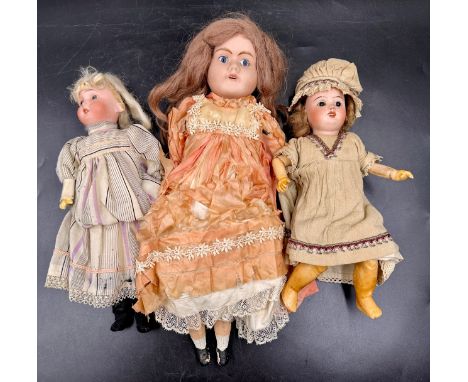 Three bisque headed dolls to include one with the head impressed 'P.R / S.F.B.J. / 60 / PARIS /8/0' approx 29cm l, with fixed