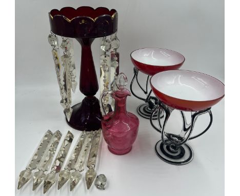 Glass to include a ruby glass lustre with extra drops, cranberry glass jug and two art glass vases. 