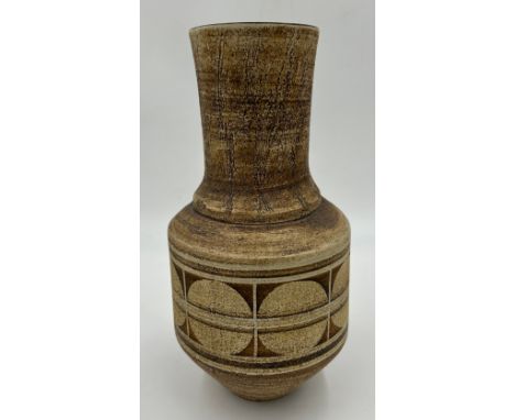 A Troika pottery circular tapered vase with geometric decoration on brown ground marked 'Troika Cornwall', 25.5cm h. 